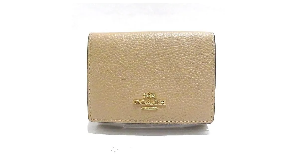 Billetera de cuero Coach con tres pliegues Castaño Beige 