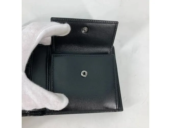 Bulgari Billetera bi-fold de cuero negro Bvlgari 