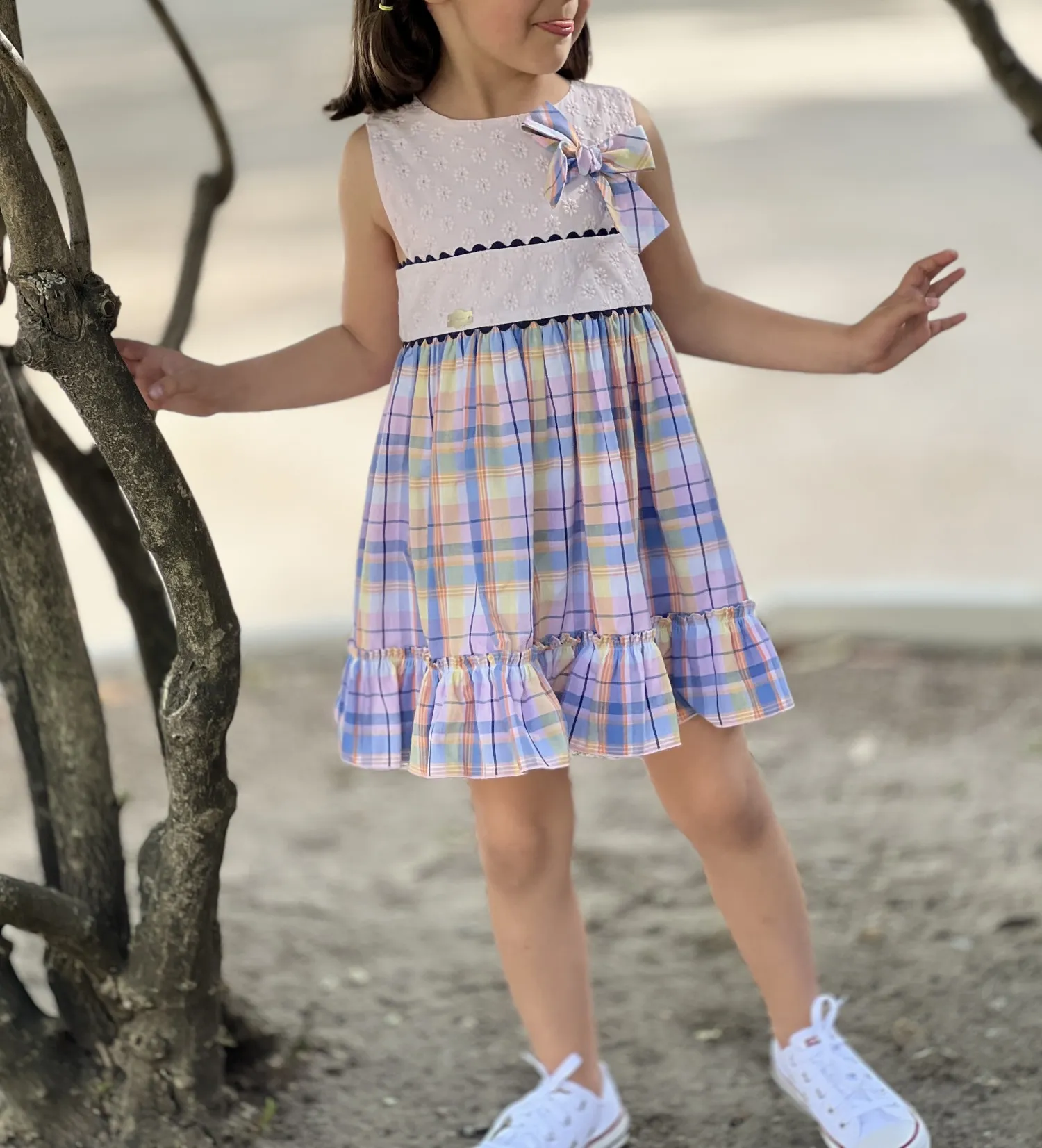 Dress with embroidered bodice and squares.