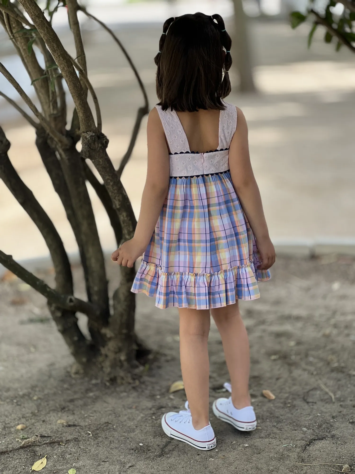 Dress with embroidered bodice and squares.