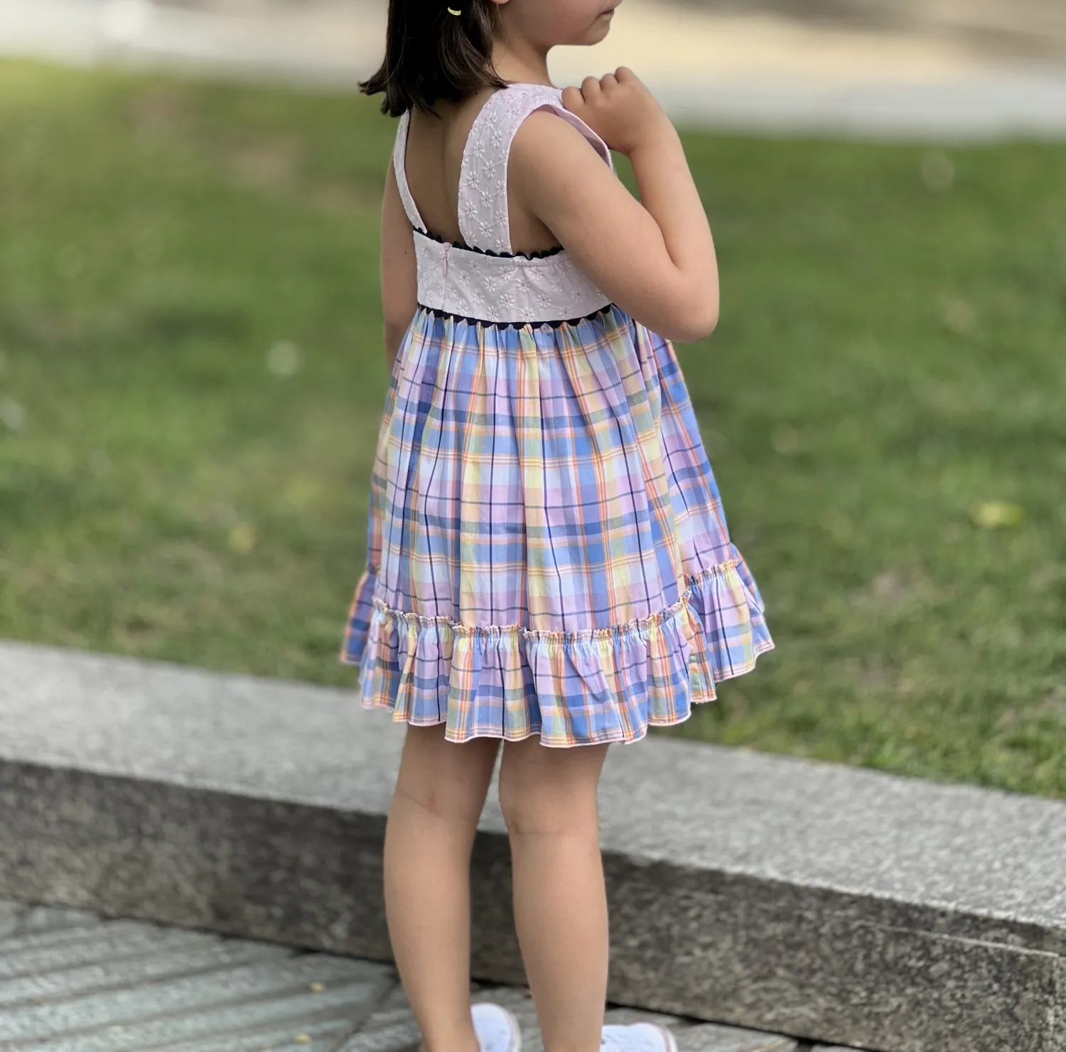 Dress with embroidered bodice and squares.