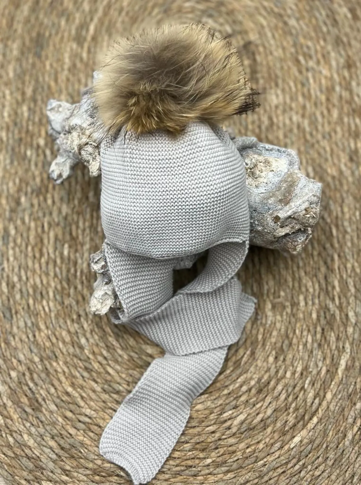 Wool hat with pom pom and scarf attached to the hat